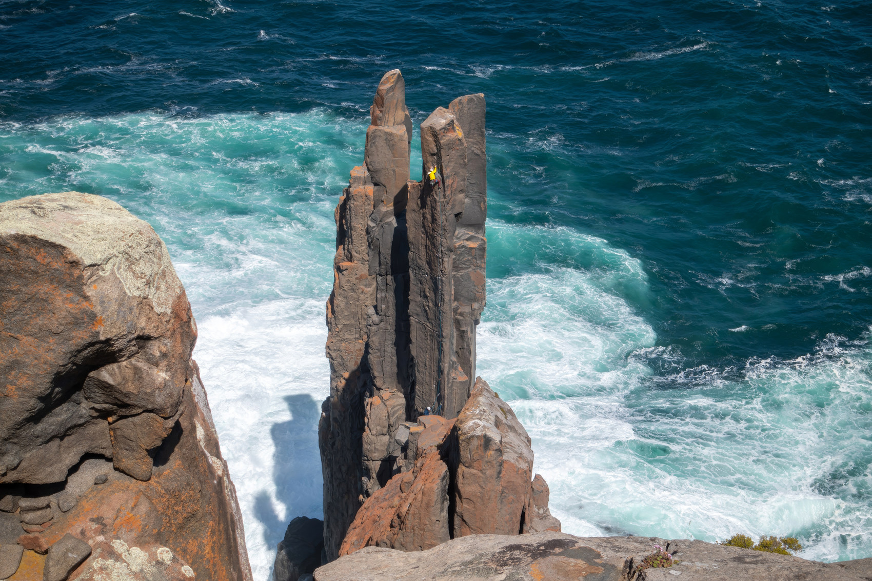 Climbing a coastal sea pillar