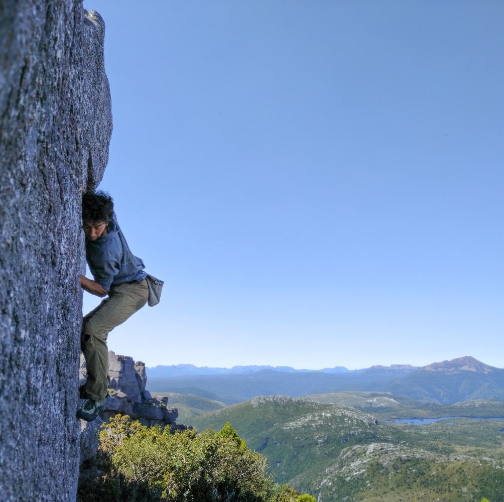 climber on a highball boulder problem